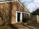 Home exterior showcases a brick facade, a black front door, and a small front yard at 2566 Stratford Ln, Morrow, GA 30260