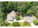 Overhead view of the house on a cul-de-sac with mature tree cover and landscaping at 2915 Preakness Nw Dr, Marietta, GA 30064