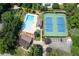Aerial view of community pool and tennis courts surrounded by mature trees at 2915 Preakness Nw Dr, Marietta, GA 30064