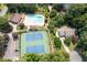 Overhead view of community pool, tennis courts and surrounding homes at 2915 Preakness Nw Dr, Marietta, GA 30064