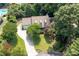 Aerial view of home with mature landscaping, driveway, and well-maintained lawn at 2915 Preakness Nw Dr, Marietta, GA 30064