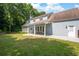 Spacious backyard with lawn, patio, and partial view of house at 2915 Preakness Nw Dr, Marietta, GA 30064