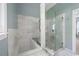 Elegant bathroom with marble-tiled shower and tub, offering a spa-like experience at 2915 Preakness Nw Dr, Marietta, GA 30064