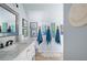 Stylish bathroom featuring marble countertop, framed artwork and decorative hand towels at 2915 Preakness Nw Dr, Marietta, GA 30064