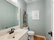 Cozy bathroom featuring a white vanity, updated fixtures, and a framed mirror at 2915 Preakness Nw Dr, Marietta, GA 30064