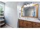 Bathroom with wooden vanity, marble countertop and shelf unit at 2915 Preakness Nw Dr, Marietta, GA 30064