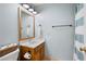 Compact bathroom with modern vanity, marble countertop and a shower curtain at 2915 Preakness Nw Dr, Marietta, GA 30064