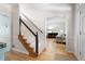 Open foyer with hardwood floors, staircase, and entryway to living room at 2915 Preakness Nw Dr, Marietta, GA 30064