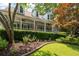 Close up of charming home with covered porch and beautifully landscaped front yard at 2915 Preakness Nw Dr, Marietta, GA 30064