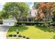 Charming home with a large, well-manicured lawn and lush landscaping at 2915 Preakness Nw Dr, Marietta, GA 30064