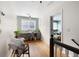 Hallway with desk space with chair on hardwood flooring leading to a bedroom at 2915 Preakness Nw Dr, Marietta, GA 30064