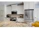 Bright kitchen with white cabinetry, stainless steel appliances, and granite countertops offer a blend of style and functionality at 2915 Preakness Nw Dr, Marietta, GA 30064