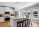 Modern kitchen with granite countertops, stainless steel appliances, and a large island with barstool seating at 2915 Preakness Nw Dr, Marietta, GA 30064