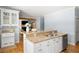 This kitchen features an island with granite countertops and modern fixtures, with easy access to the living area at 2915 Preakness Nw Dr, Marietta, GA 30064