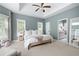 Serene main bedroom with neutral tones, a tray ceiling, and abundant natural light creates a peaceful retreat at 2915 Preakness Nw Dr, Marietta, GA 30064