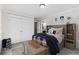 Charming bedroom featuring playful decor, a cozy bed, and ample storage space at 327 6Th Ne St, Atlanta, GA 30308