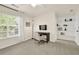 This bedroom has a window with natural light, closet, and a study space at 833 Society Ct, Woodstock, GA 30188