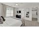Bright bedroom featuring a modern dresser, walk-in closet, and plush carpeting at 833 Society Ct, Woodstock, GA 30188