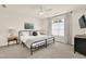 A bedroom featuring a large window for natural light and ample space at 833 Society Ct, Woodstock, GA 30188