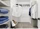 Walk-in closet with shelving and ample storage space for clothing and accessories at 833 Society Ct, Woodstock, GA 30188