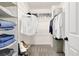 Organized walk-in closet with shelving and hanging space for clothing and accessories at 833 Society Ct, Woodstock, GA 30188