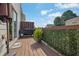 Outdoor deck with grill and greenery for dining or entertaining at 833 Society Ct, Woodstock, GA 30188