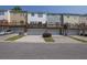 Exterior view of townhomes with attached garages and wooden decks; a great, convenient community at 833 Society Ct, Woodstock, GA 30188