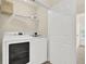 Efficient laundry area with washer and dryer plus space for storage at 833 Society Ct, Woodstock, GA 30188
