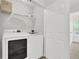 Efficient laundry room with modern washer and dryer and wire shelving for storage at 833 Society Ct, Woodstock, GA 30188