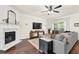Inviting living room with a fireplace, hardwood flooring, and neutral decor at 833 Society Ct, Woodstock, GA 30188