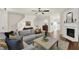 Warm living room with hardwood floors, fireplace, and staircase at 833 Society Ct, Woodstock, GA 30188