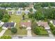 Aerial view of home featuring mature trees, a well-manicured lawn, shed, and above ground pool at 992 Harbins Pass Dr, Dacula, GA 30019