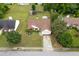 An aerial view displays the home featuring manicured lawn, trampoline, shed, and beautiful landscaping at 992 Harbins Pass Dr, Dacula, GA 30019