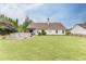 Spacious backyard featuring well-maintained lawn, partial fence, above ground pool and lush landscaping at 992 Harbins Pass Dr, Dacula, GA 30019