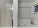 Bright bathroom featuring a large soaking tub with shower and bright light at 992 Harbins Pass Dr, Dacula, GA 30019