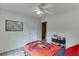 The bedroom has a ceiling fan, white walls, and hardwood floors at 992 Harbins Pass Dr, Dacula, GA 30019