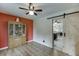 Dining room with wood floors, stylish cabinet, and access to the kitchen at 992 Harbins Pass Dr, Dacula, GA 30019