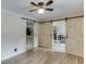 Dining room with sliding barn doors that lead to kitchen and living spaces at 992 Harbins Pass Dr, Dacula, GA 30019