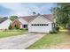Charming home with a well maintained lawn and two car garage at 992 Harbins Pass Dr, Dacula, GA 30019