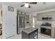 Kitchen showcases stainless steel appliances, light cabinets, and plenty of counter space at 992 Harbins Pass Dr, Dacula, GA 30019
