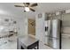 View of kitchen with stainless appliances, tile backsplash, and updated cabinets at 992 Harbins Pass Dr, Dacula, GA 30019