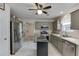 Updated kitchen with stainless appliances, central island, and neutral color palette at 992 Harbins Pass Dr, Dacula, GA 30019