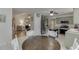 Bright eat-in kitchen featuring stainless steel appliances and a view to the living room at 992 Harbins Pass Dr, Dacula, GA 30019