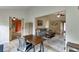 A living room offers a spacious area with a gray couch, a patterned rug, and hardwood floors at 992 Harbins Pass Dr, Dacula, GA 30019