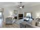 Spacious living room with high ceilings, fireplace, and wood floors at 992 Harbins Pass Dr, Dacula, GA 30019