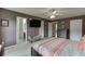 Comfortable main bedroom with a large flat-screen TV and ensuite bathroom access at 992 Harbins Pass Dr, Dacula, GA 30019