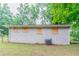 Rear exterior showcasing the house and its surrounding greenery, adding to its curb appeal at 1421 Dennis Dr, Decatur, GA 30032