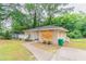 Charming single-story home with a well-maintained lawn and paved walkway at 1421 Dennis Dr, Decatur, GA 30032