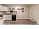 Bright kitchen featuring white cabinets and an appliance at 1421 Dennis Dr, Decatur, GA 30032