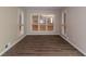 Bright living room featuring hardwood floors and natural light from the large windows at 1421 Dennis Dr, Decatur, GA 30032